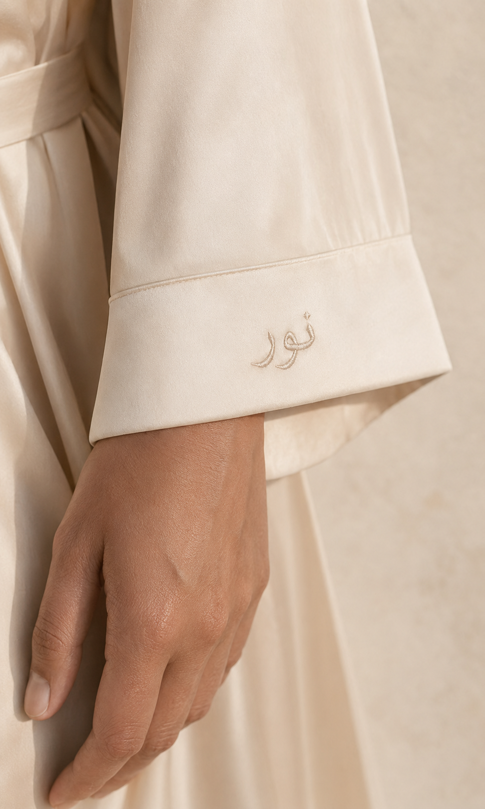 Arabic name embroidered on the cuff of The Sabine Robe