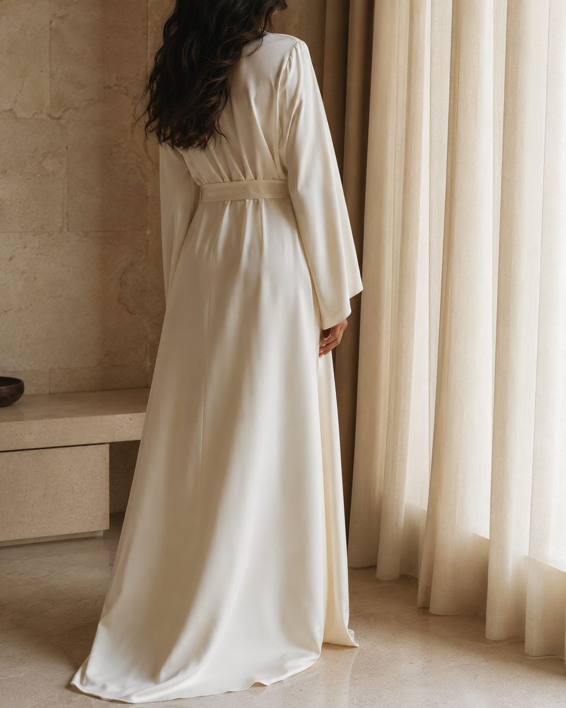 The Sabine Robe in warm ivory silk, seen from behind